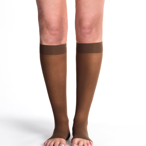 Sigvaris Style Sheer women's open-toe compression socks in Mocha, worn by a model