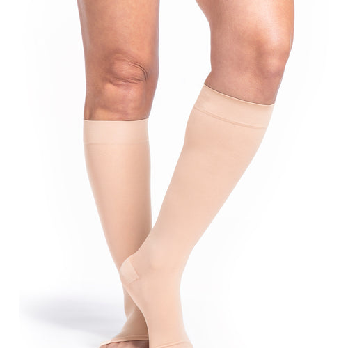 Sigvaris Style Sheer women's open-toe compression socks in Honey, worn by a model