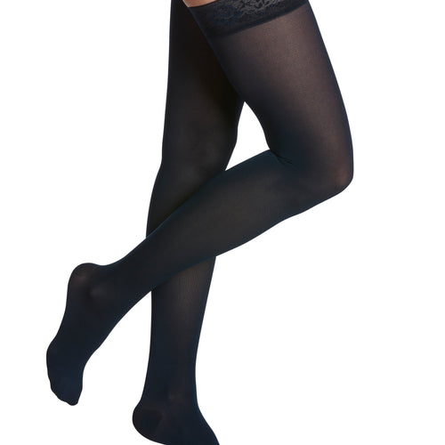 Sigvaris Style Soft Opaque Women's Thigh-High Compression Stockings in Midnight Blue, worn by a model
