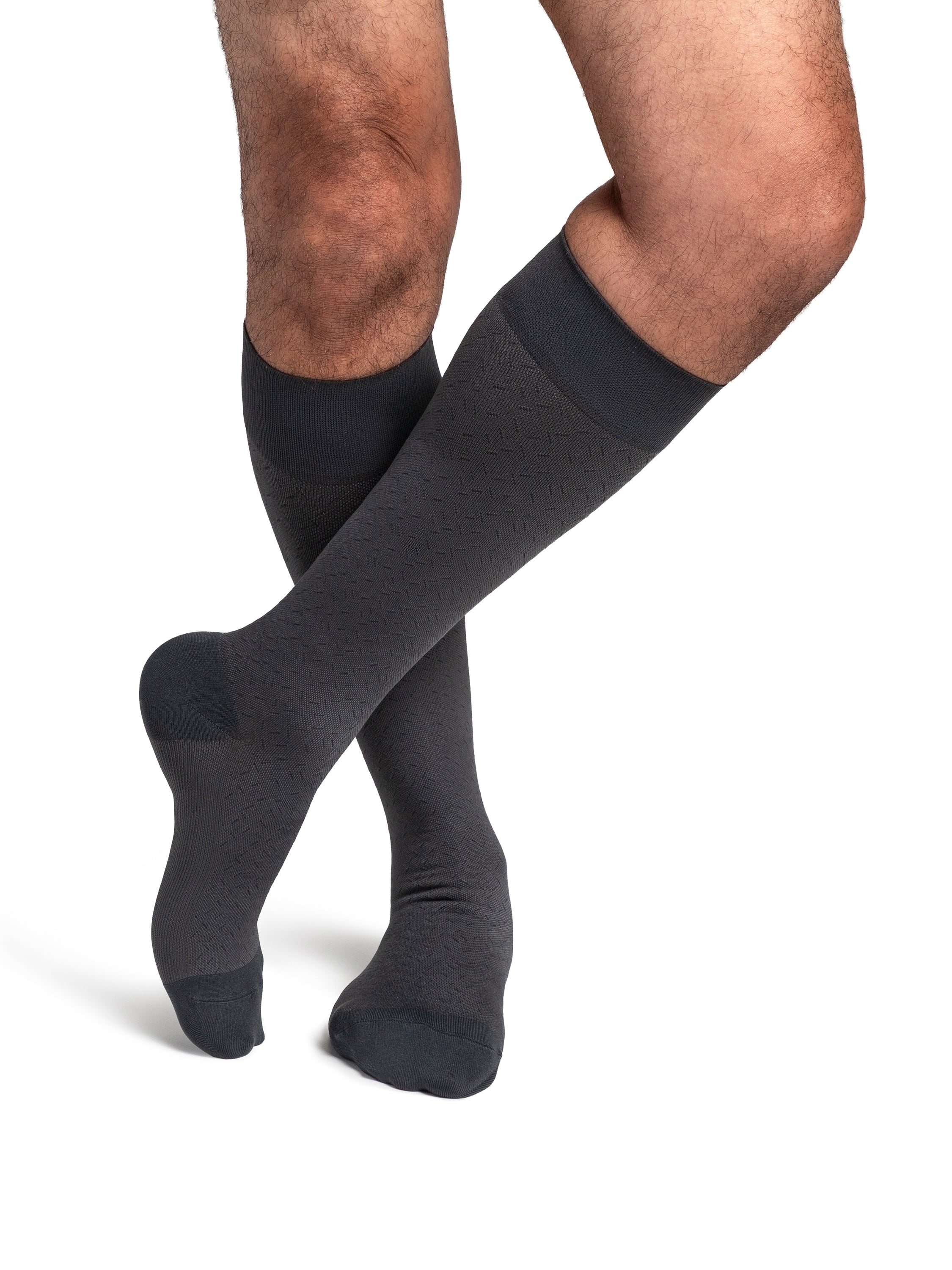 Sigvaris Style Microfibre Patterns men's compression socks in Graphite Confetti, worn by a model, right-side view